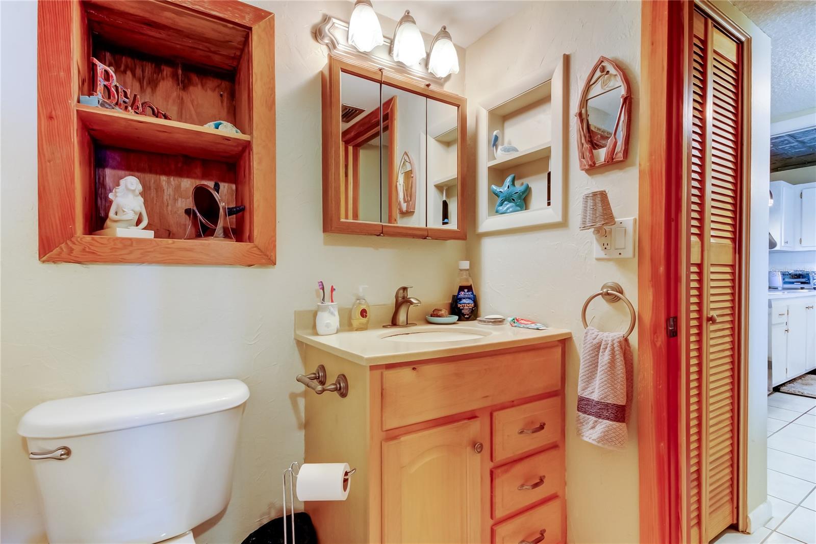 View from Bathroom to Entry Hall and Kitchen