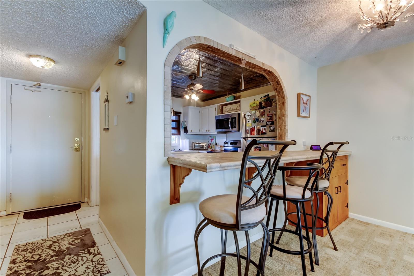 Front Door and Pass Through to the Kitchen - The Breakfast Bar is an added Bonus!