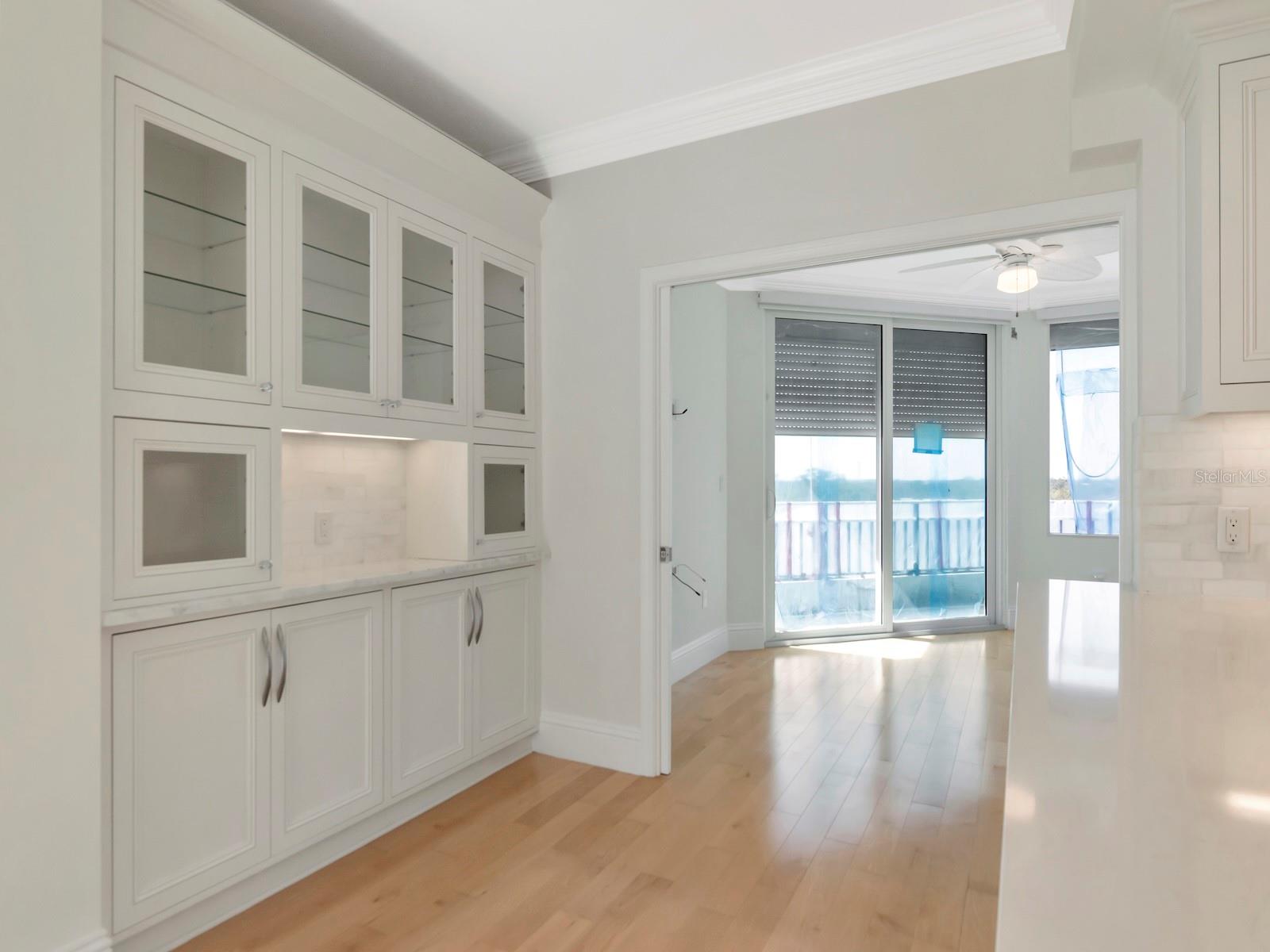 Kitchen w/Built-in Cabinets & Bar Area