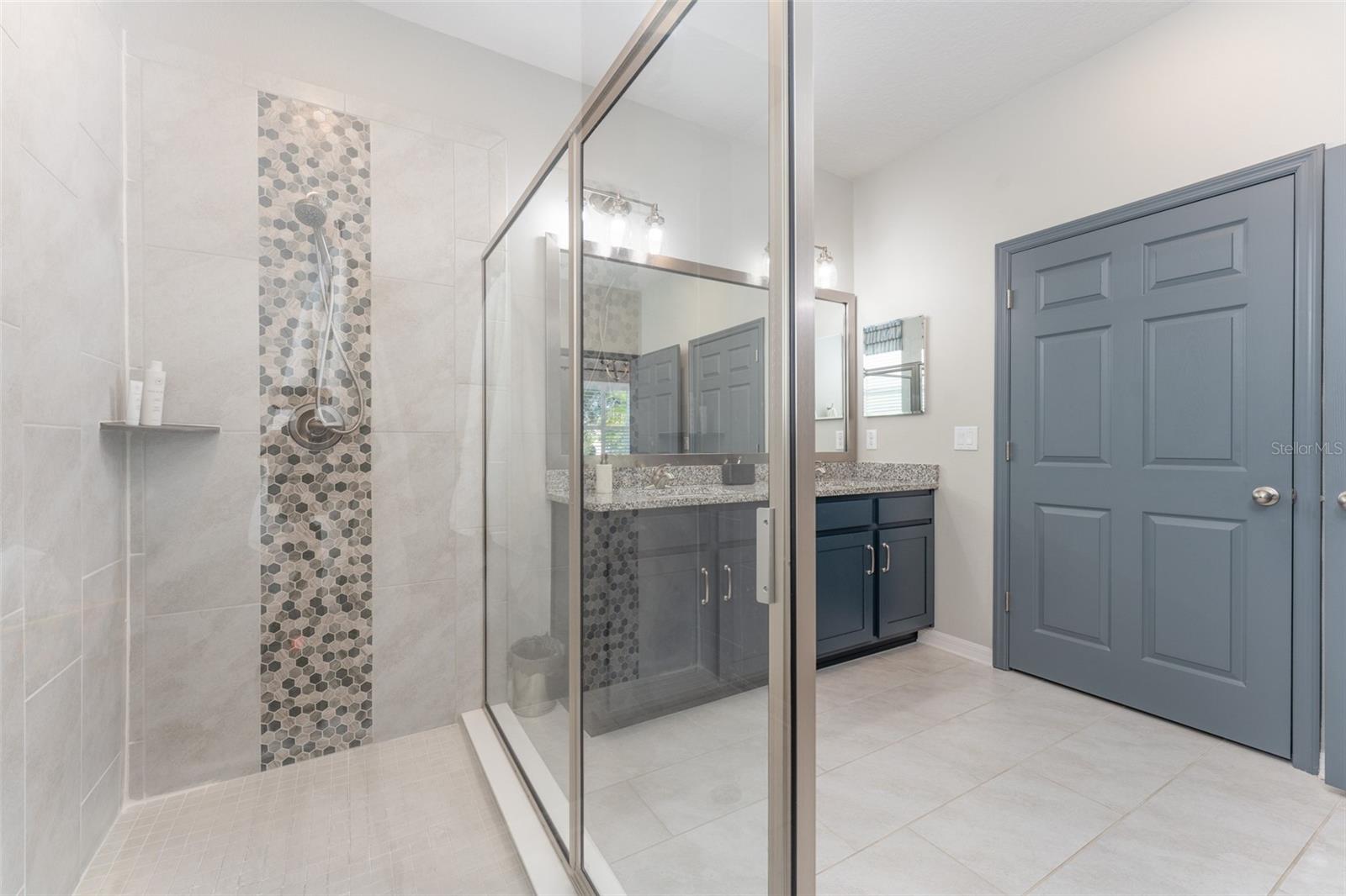 Primary Walk in Shower with Pretty Tile Accents