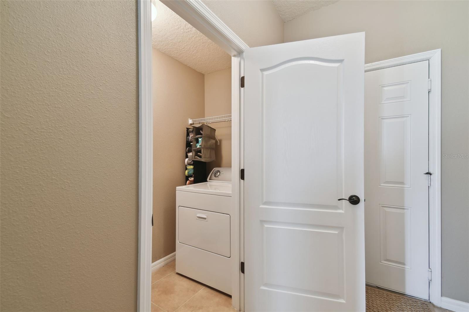 Laundry room with full size washer and dryer