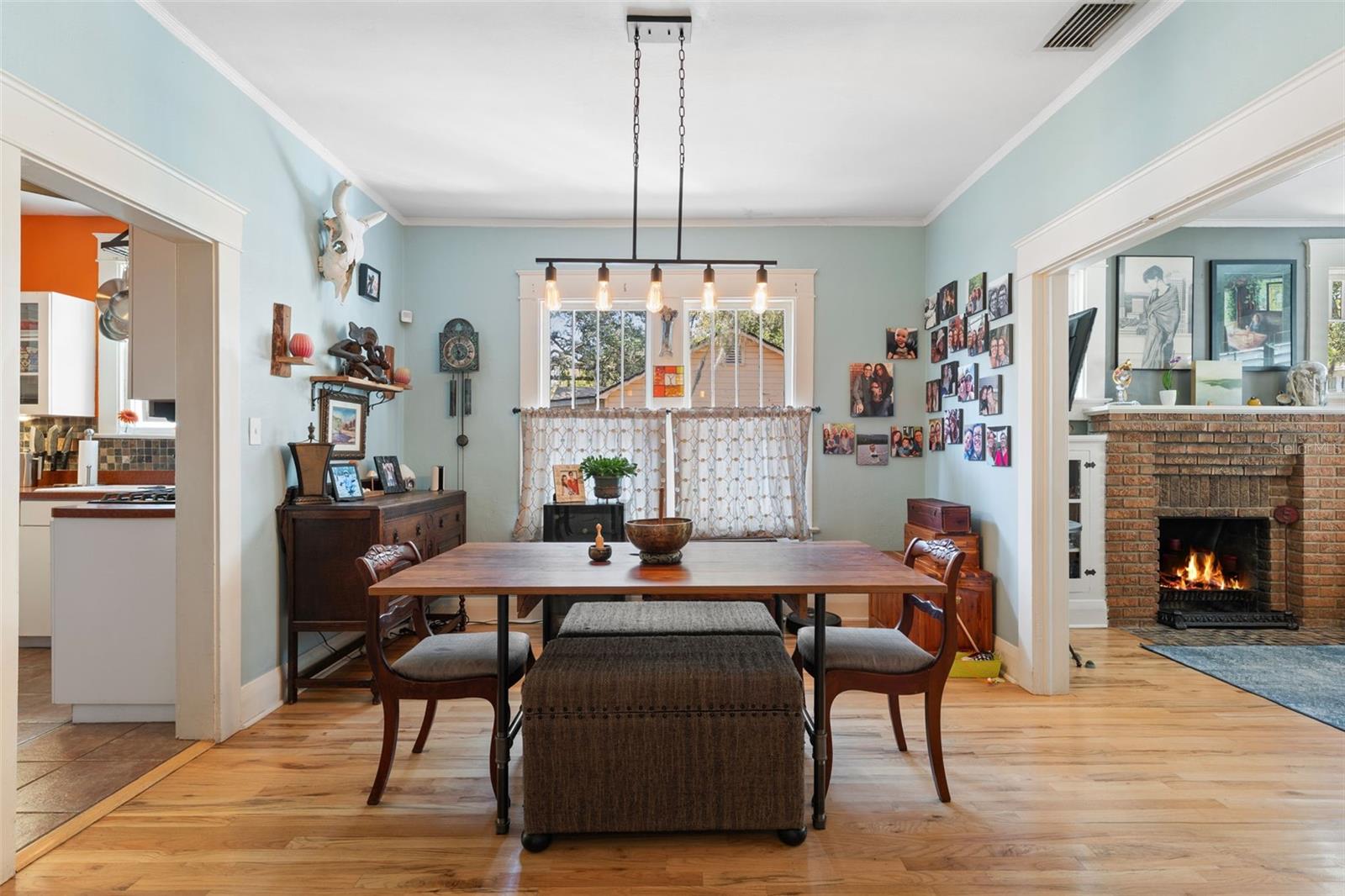 Spacious dining room with vintage windows and wood trim.