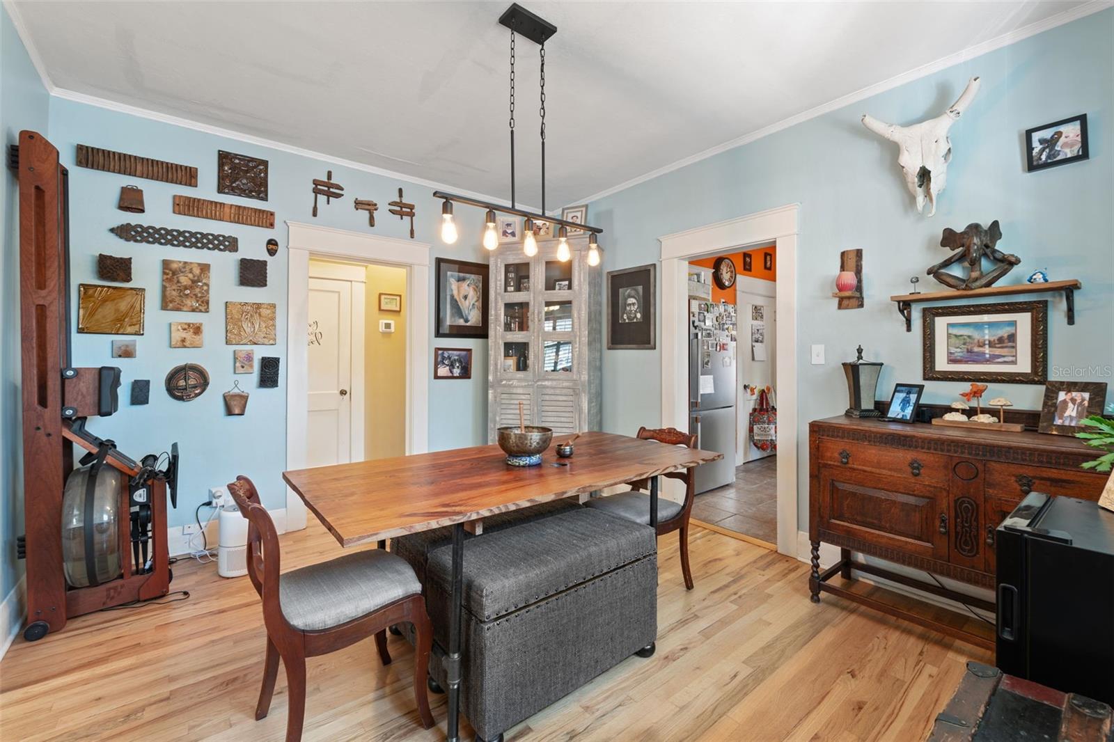 Spacious dining room with vintage windows and wood trim.