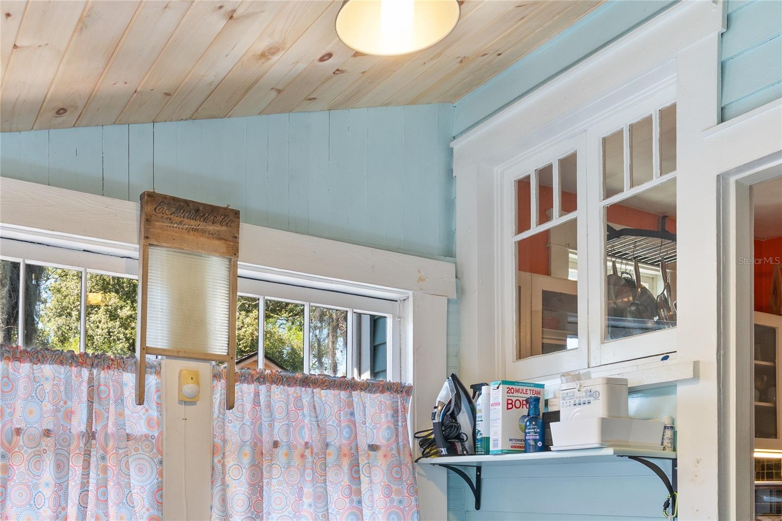 Lovely wood ceiling and original windows in the laundry/mudroom