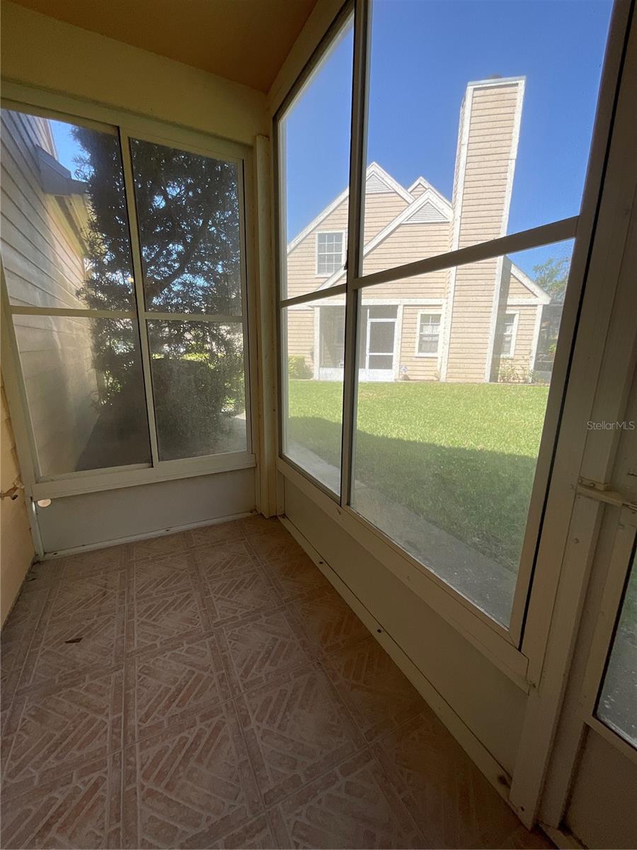 Back covered porch with vinyl windows for rainy or winter days