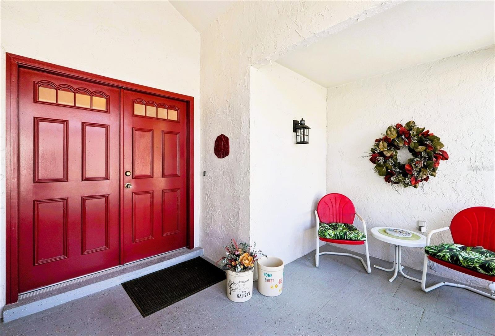 Front doors in the enclosed front screened room