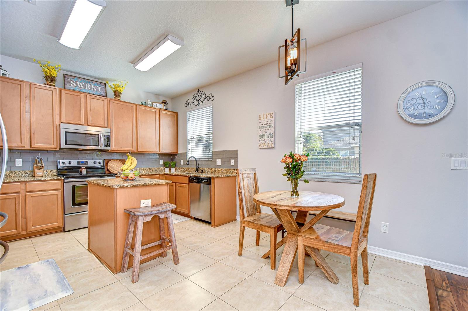 The cozy breakfast nook offers a delightful space for morning coffee, while ample natural light brightens every corner.