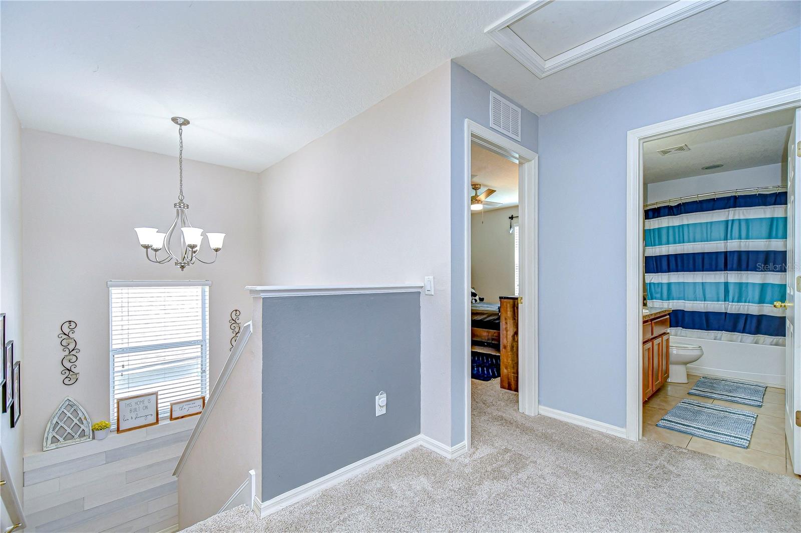 Venture upstairs in this charming home to discover a thoughtfully designed landing area that seamlessly connects to the inviting bedrooms and a stylishly appointed bathroom.
