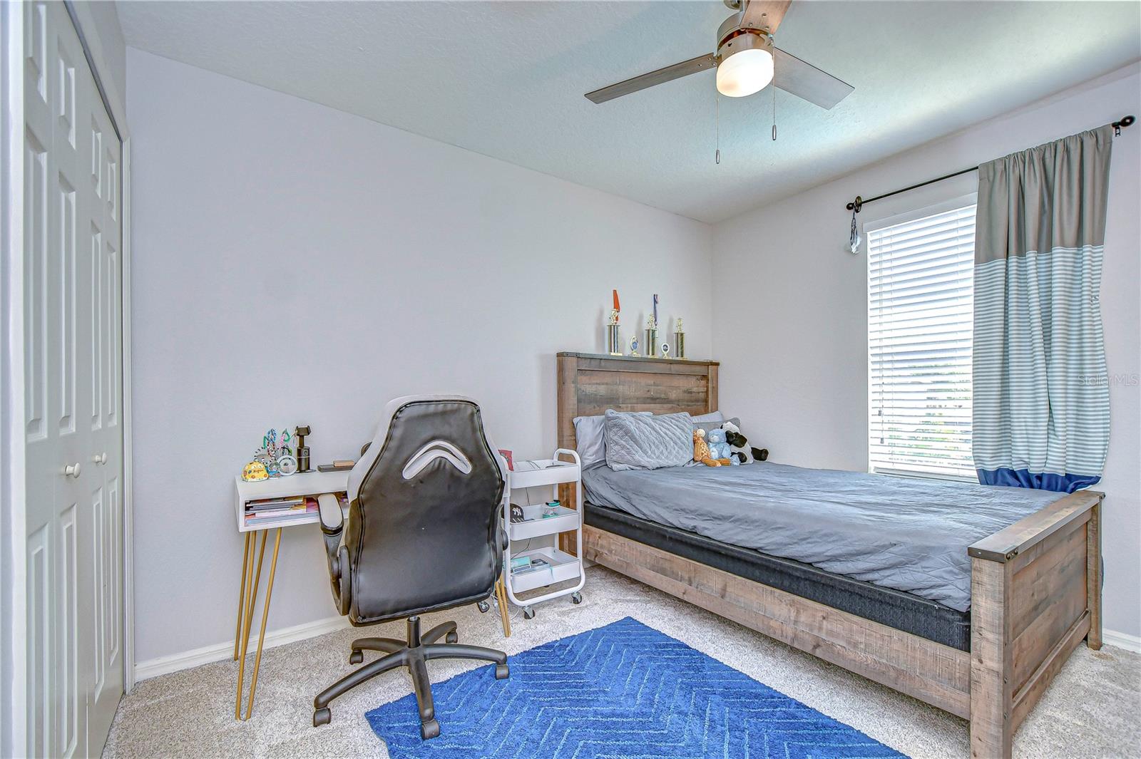 This inviting bedroom offers a perfect blend of comfort and style