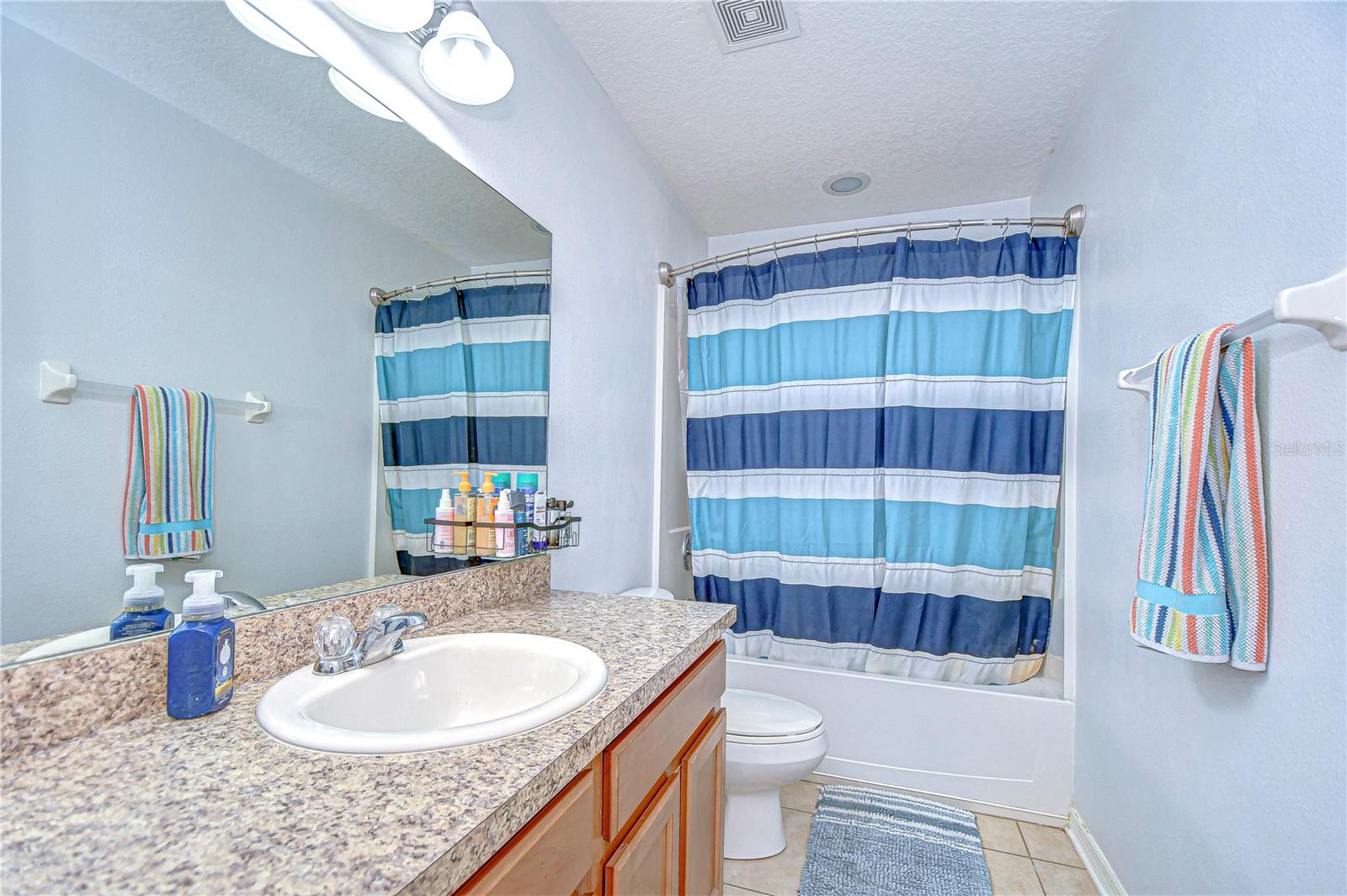 Step into a world of refreshing simplicity with this bathroom's bright, airy ambiance.
