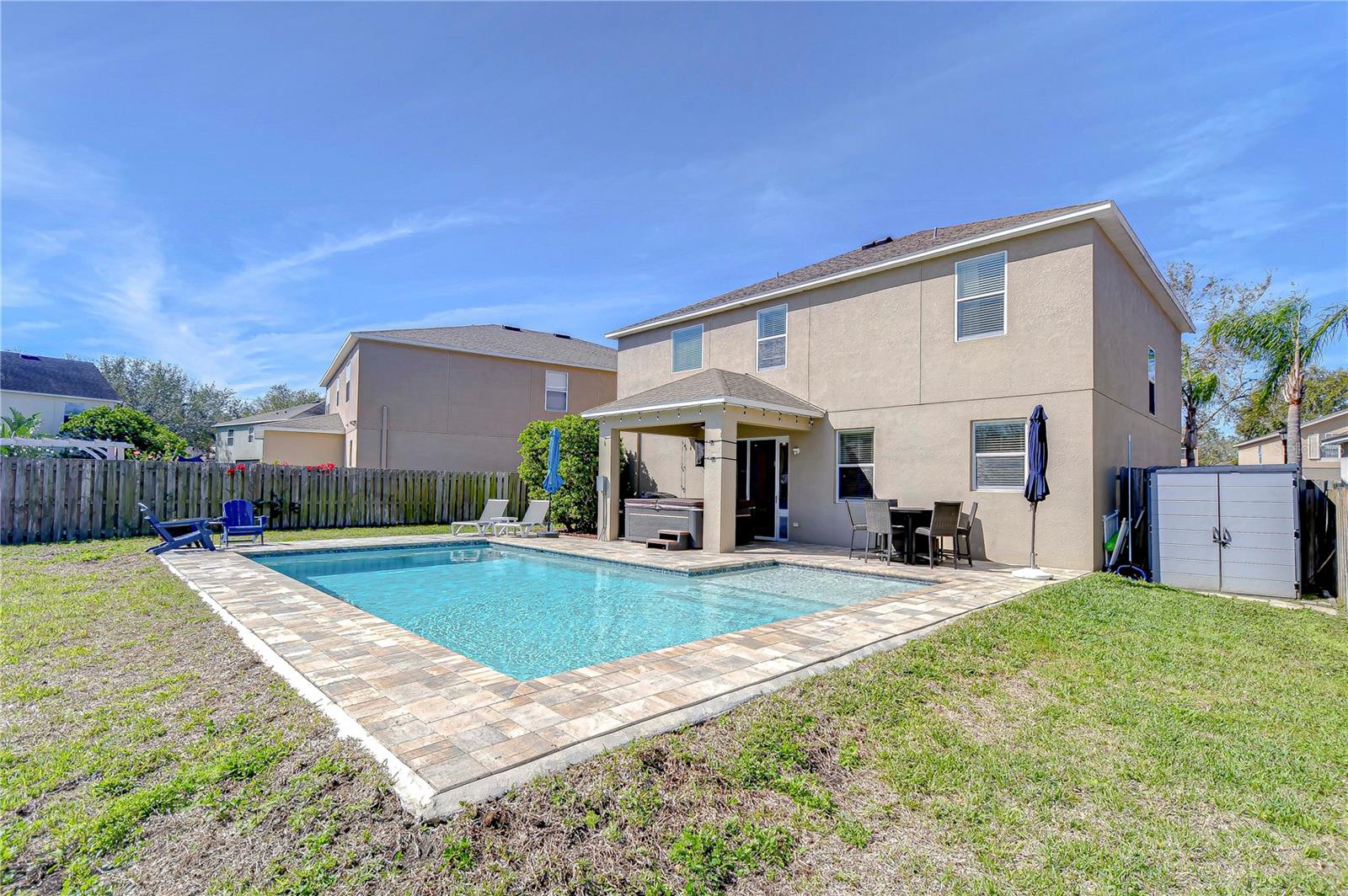 Step into your own private oasis with this splendid backyard retreat featuring a sparkling pool and ample patio space for entertaining.