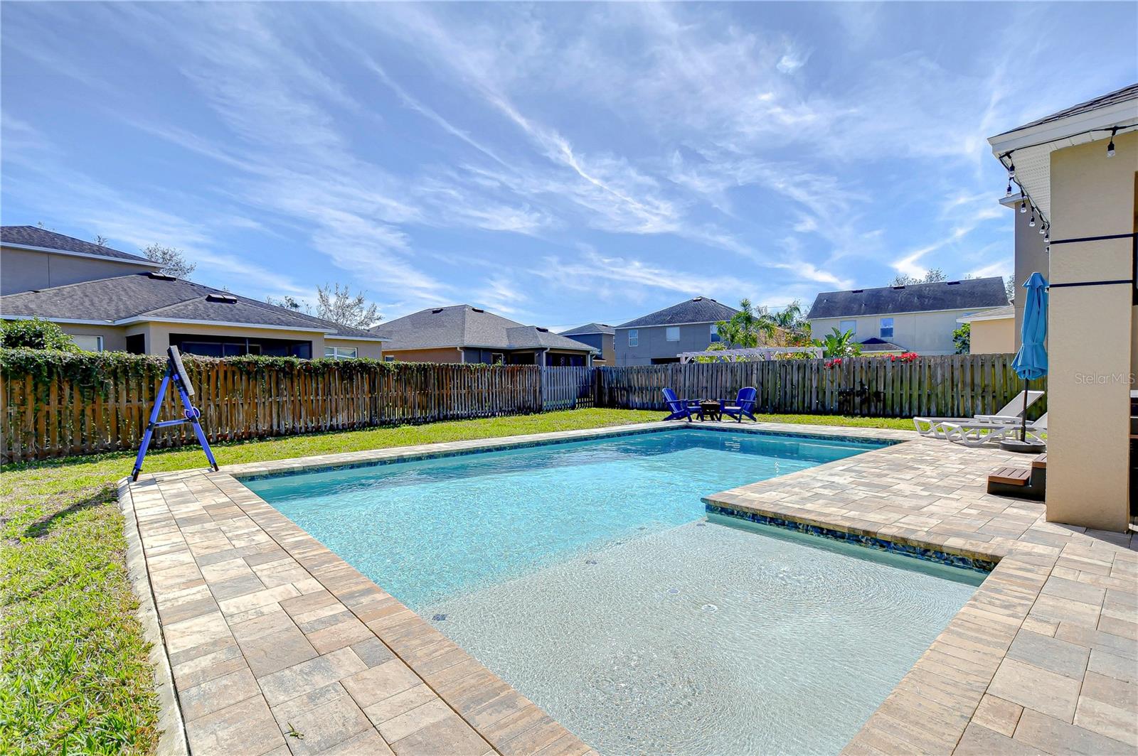This serene escape is complemented by a spacious patio, ideal for entertaining or simply enjoying a quiet afternoon.