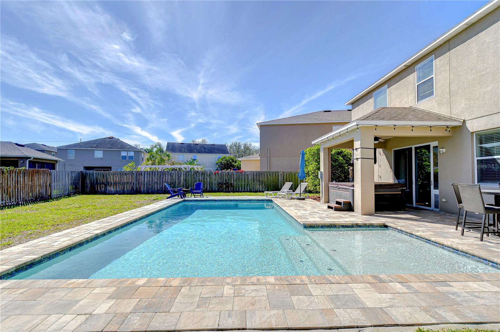 This stunning backyard pool, accompanied by a spacious patio, sets the stage for endless relaxation and entertainment.