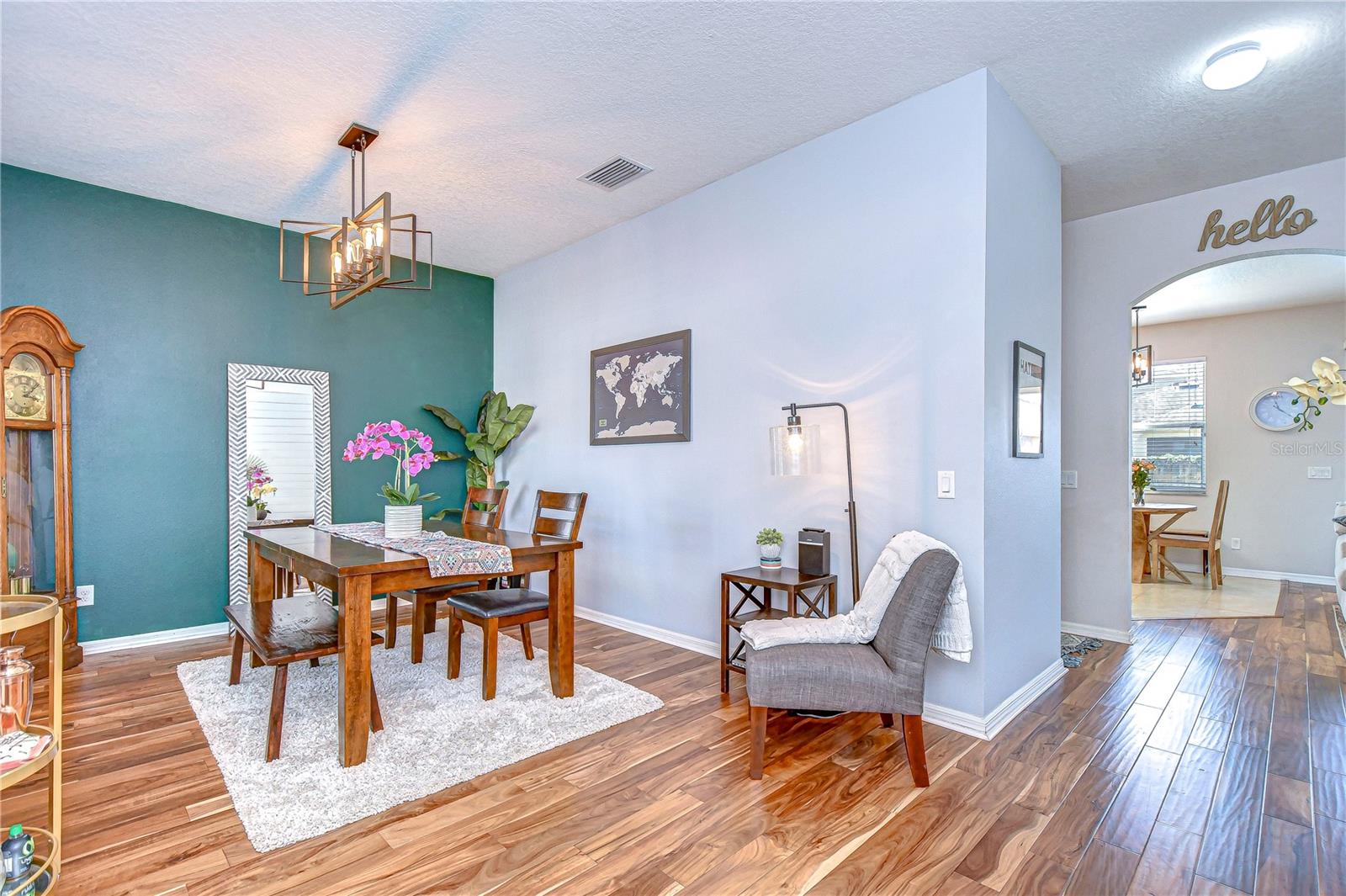 Step into this elegant dining area, where sophisticated design meets cozy charm.