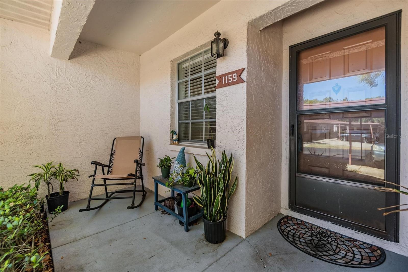 Front entry with patio and personal gardening space