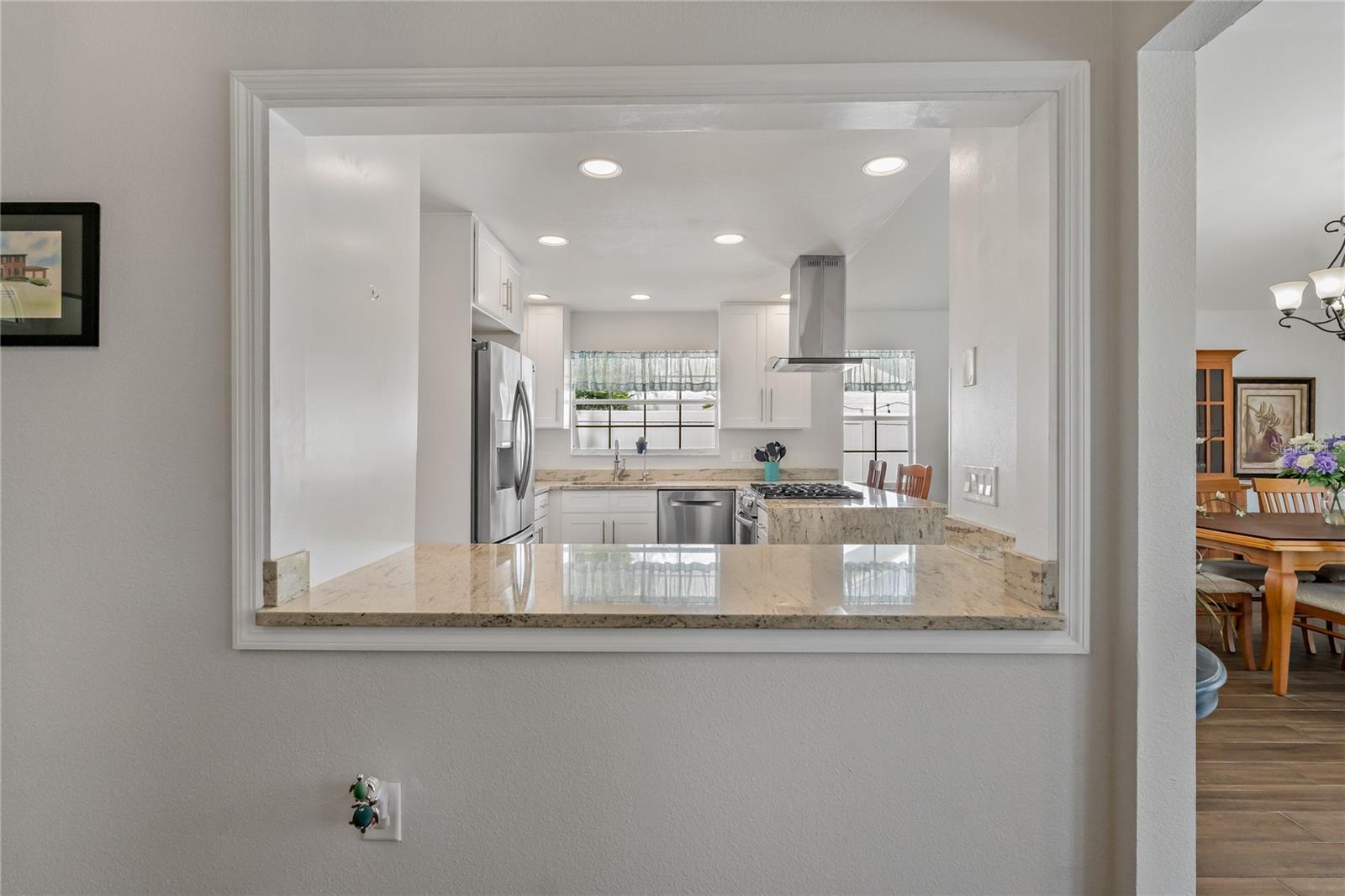 KITCHEN OPENS TO THE FAMILY ROOM