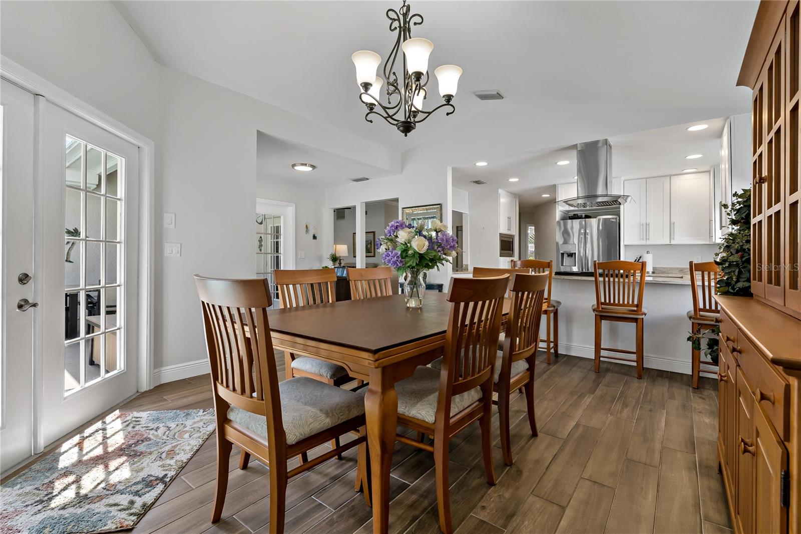 SPACIOUS DINING ROOM WITH ROOM FOR A HUTCH AND THE CUSTOM BUILT-IN CABINETS