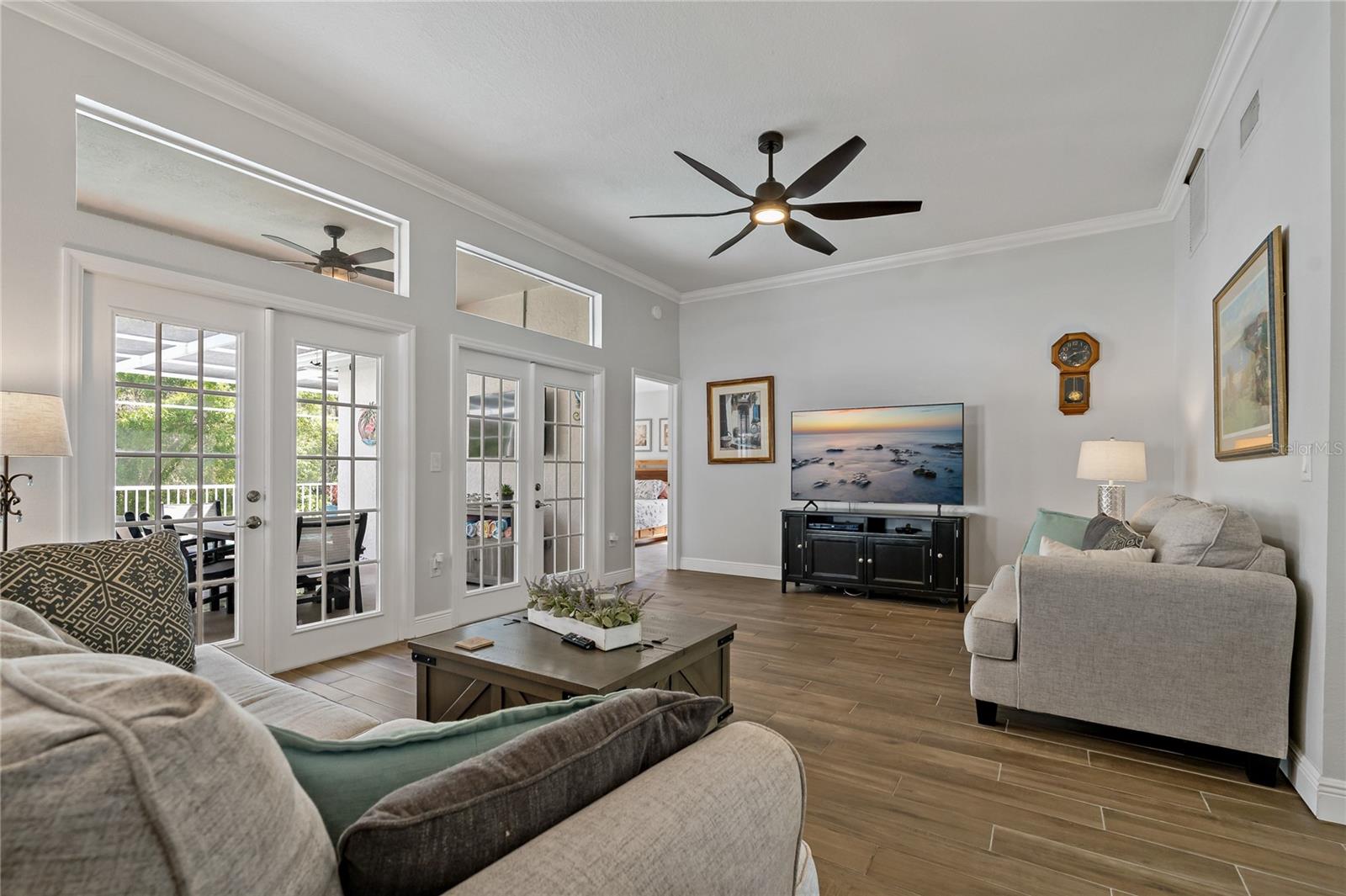 FRENCH DOORS PROVIDING ACCESS TO THE BACKYARD OASIS