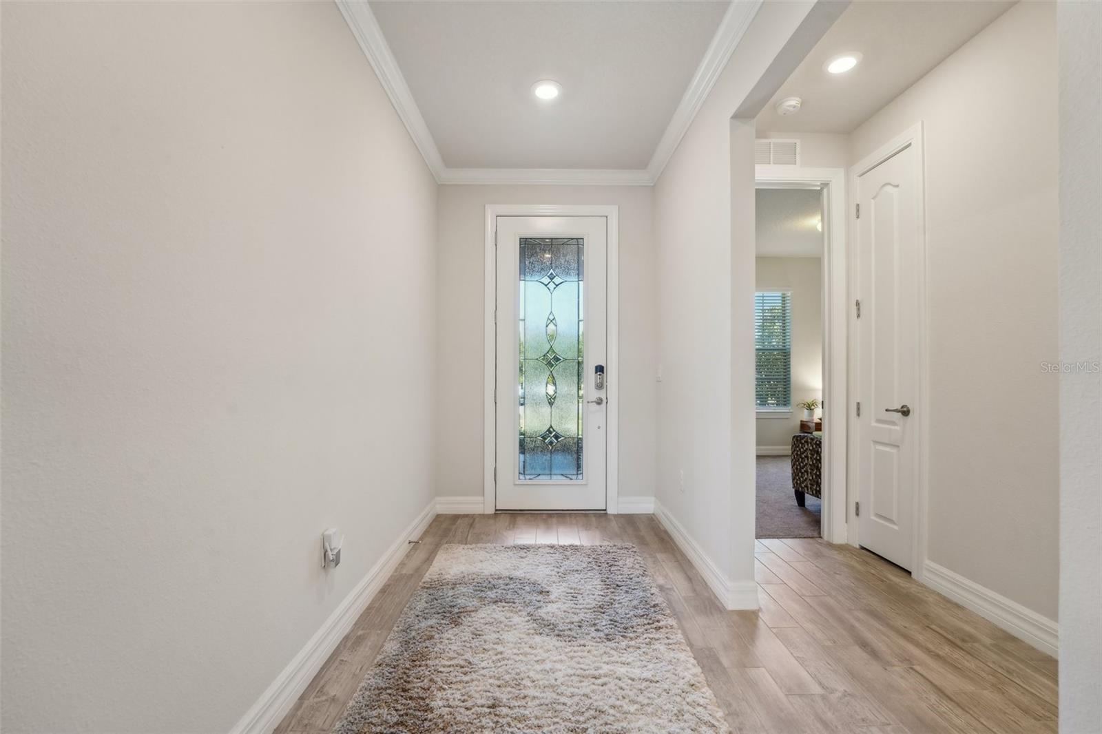 ENTRY HALLWAY PROVIDES PRIVACY FROM FRONT DOOR