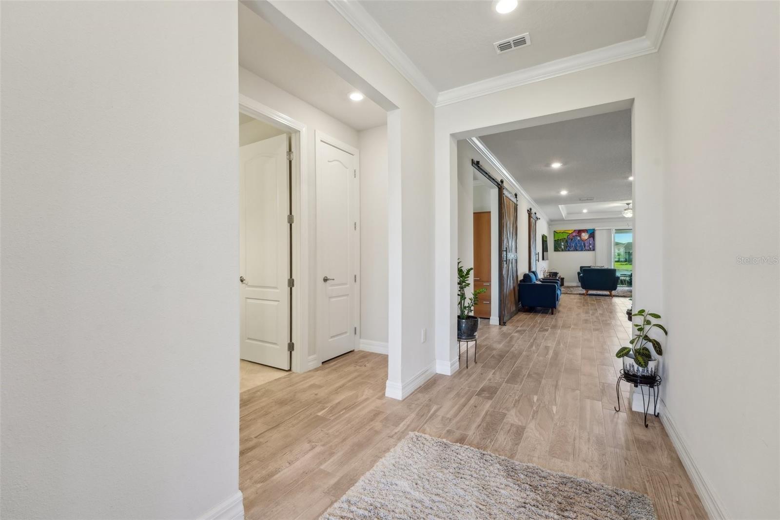 ENTRY HALLWAY PROVIDES PRIVACY FROM FRONT DOOR