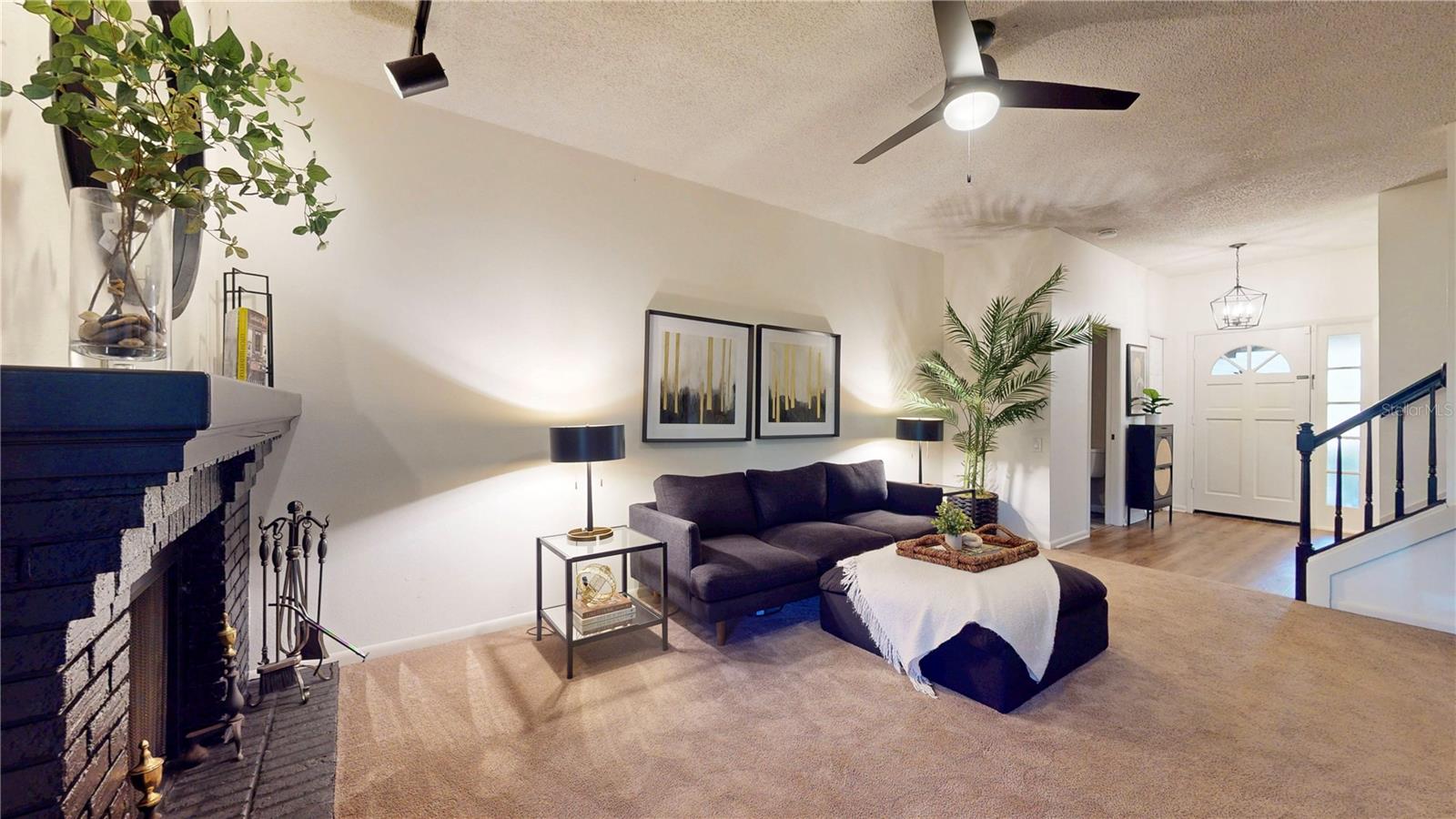 Living room, looking toward the front entrance.