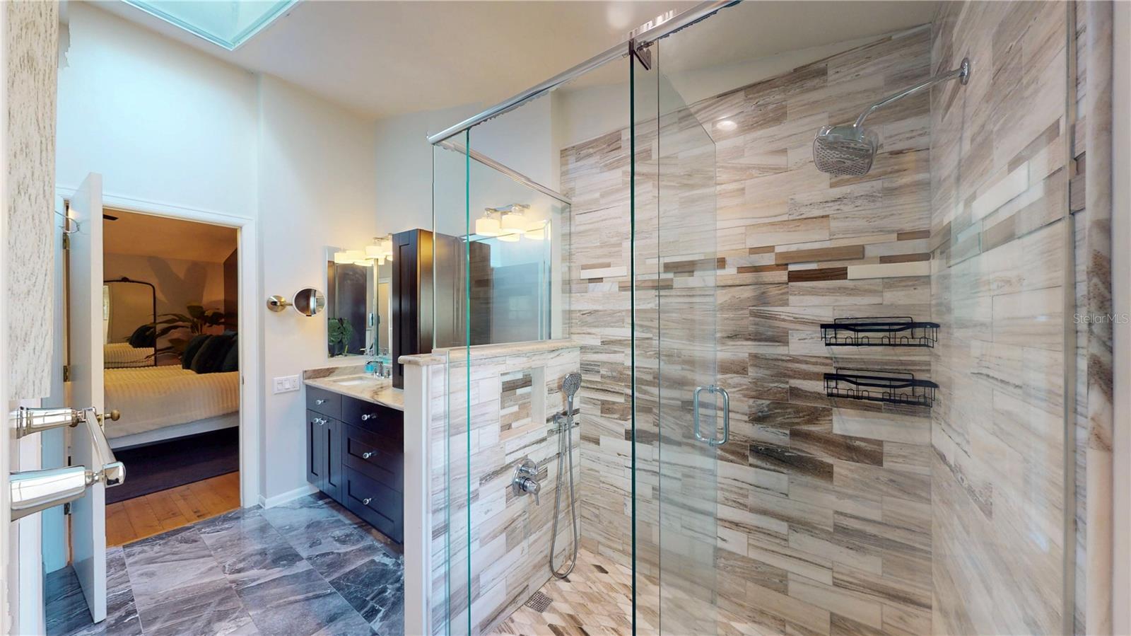 Another view of the primary bath shower, from the back of the bathroom looking toward the bedroom