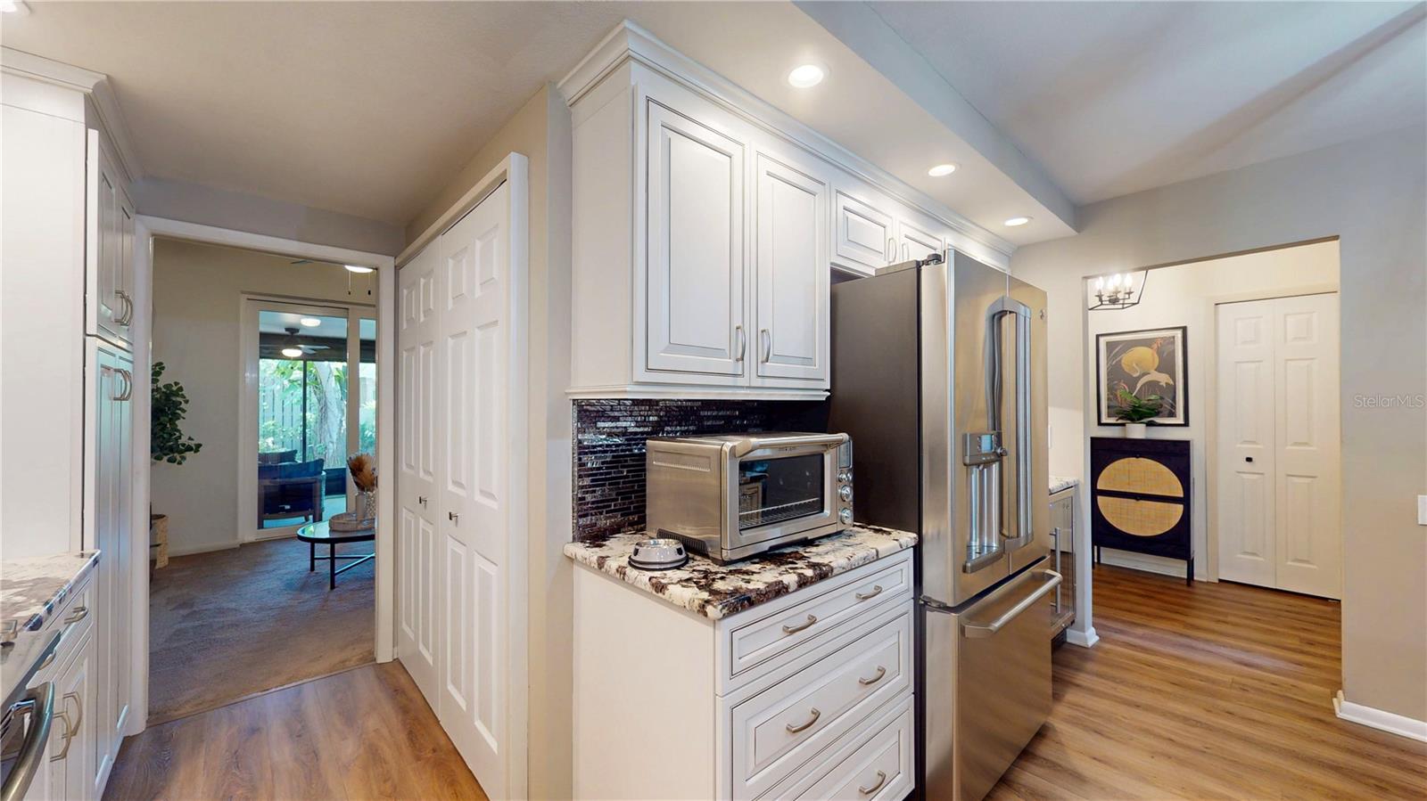 Kitchen, looking toward front foyer and dining room