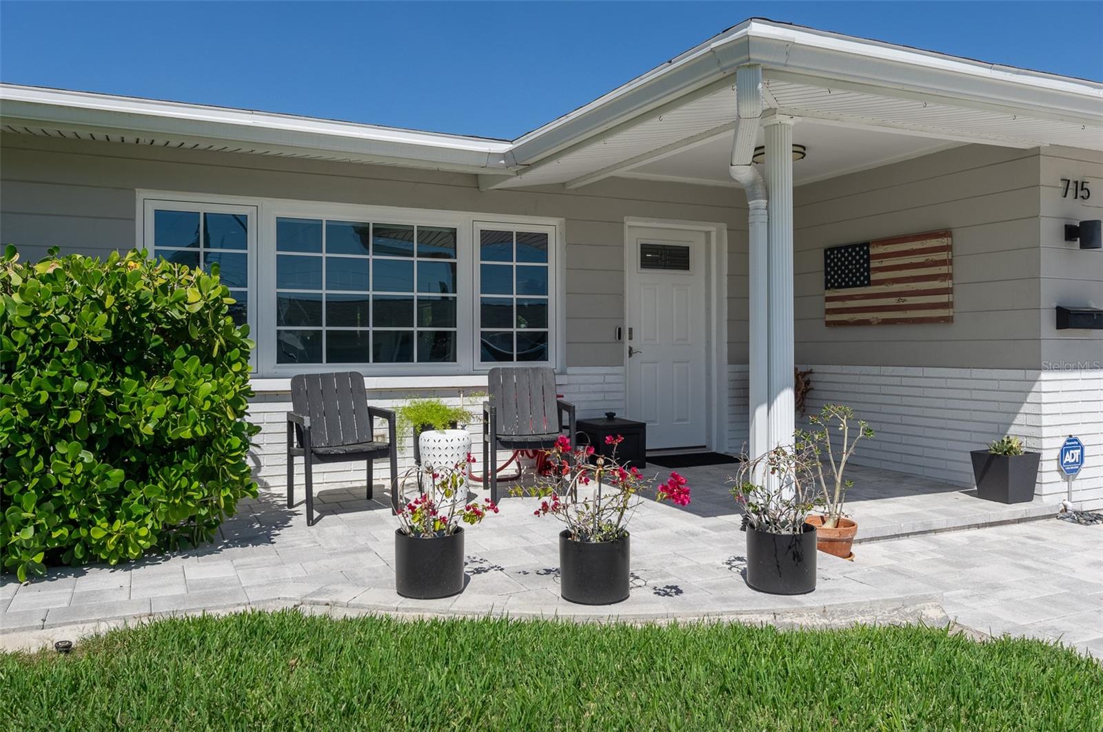 Gutters and downspouts all around the house, most tied to The French Drain