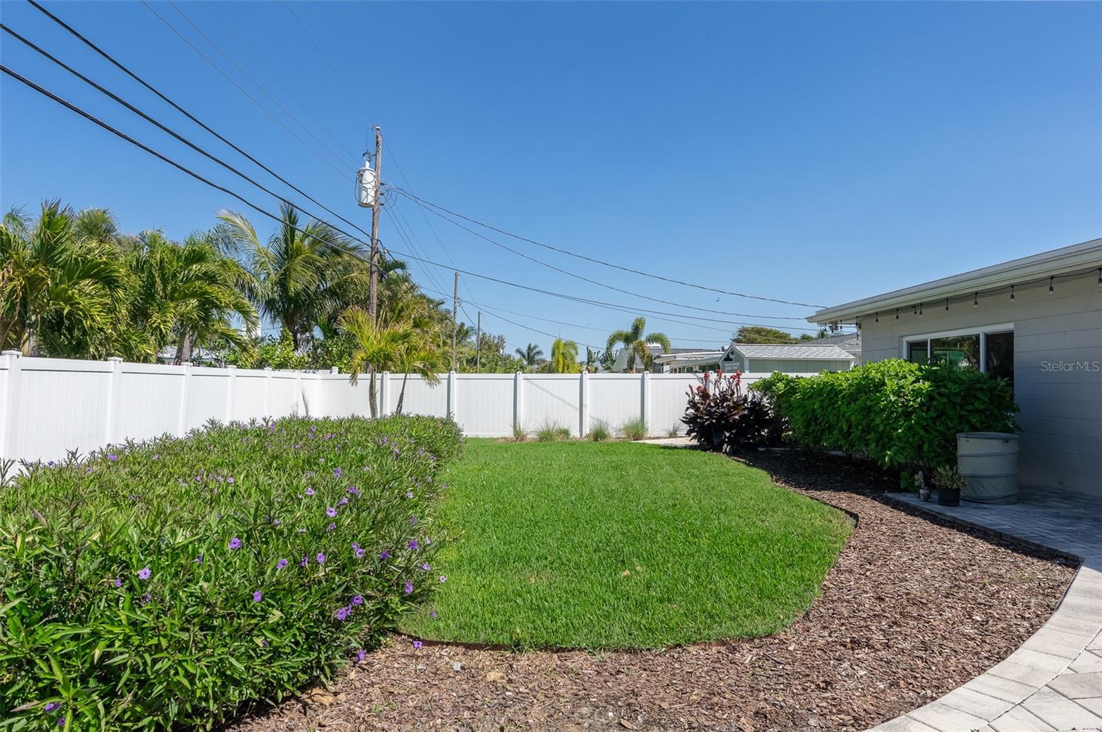 Backyard with vinyl fence for privacy