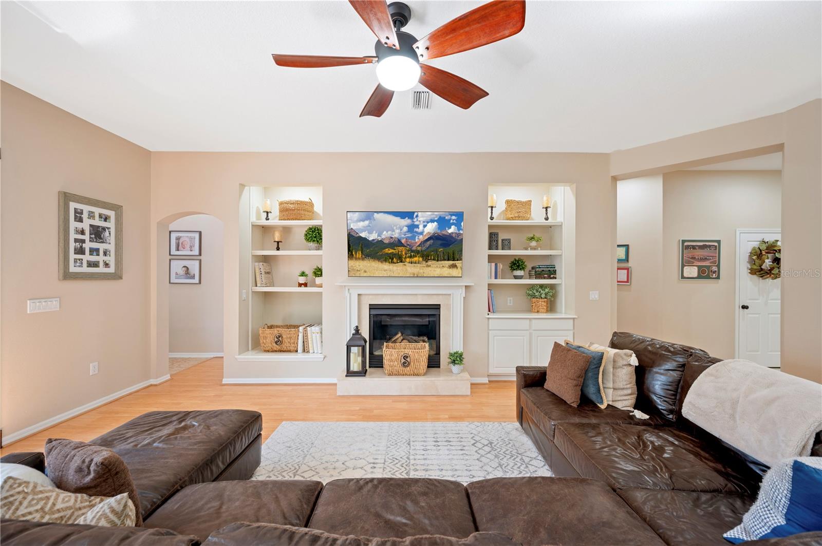 Grand room with Fireplace and custom built ins.