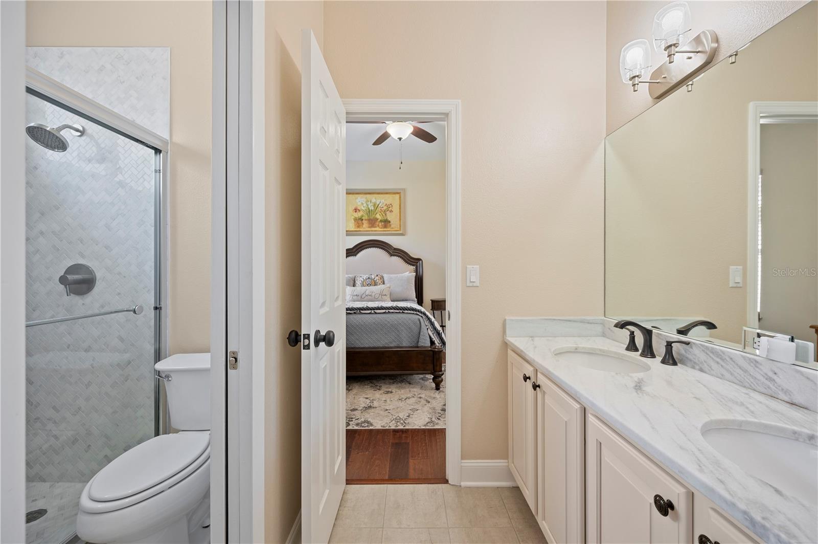 Jack and Jill Bath with new lighting, counters and shower.