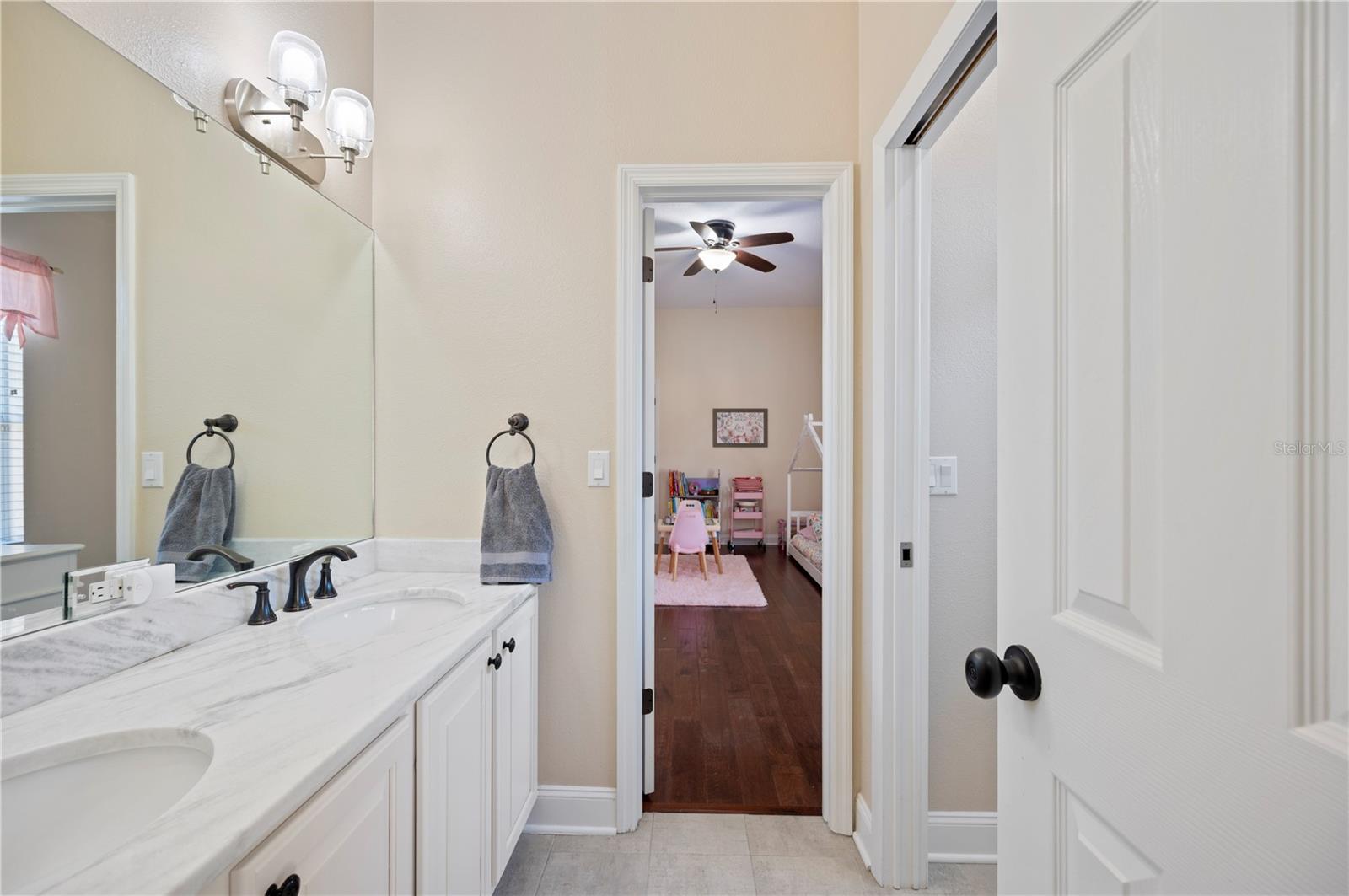 Jack and Jill Bath with Quartz counters and updated shower