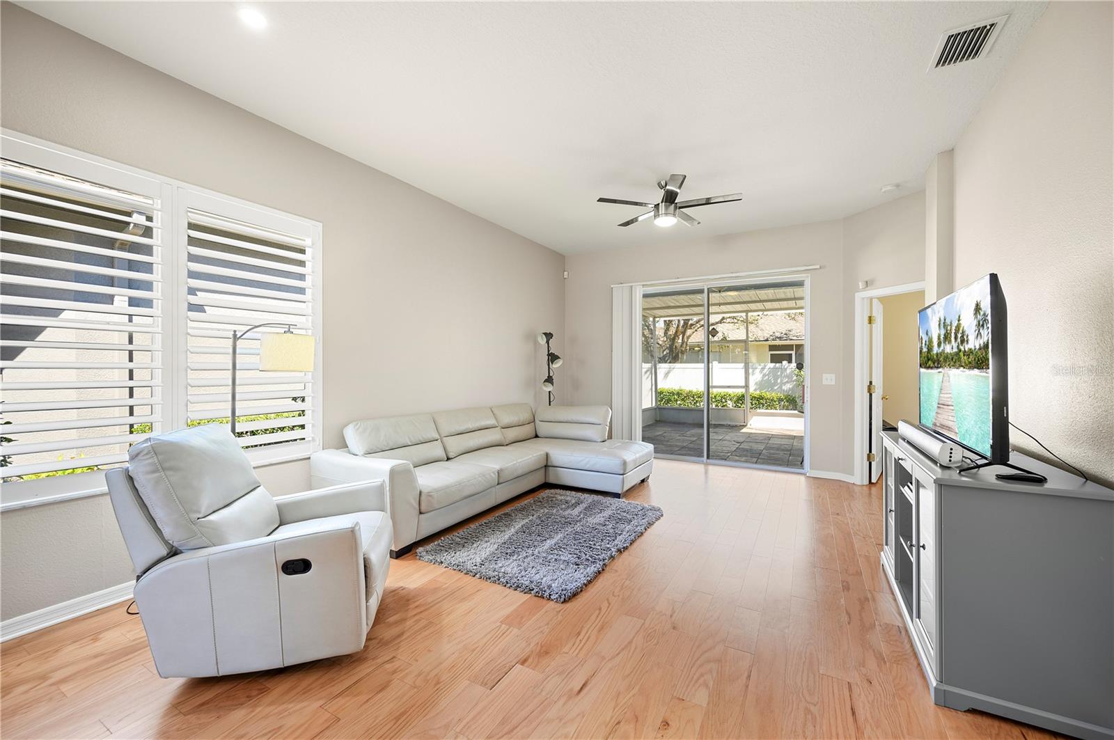 Grand room with walls of glass bringing in the natural light.