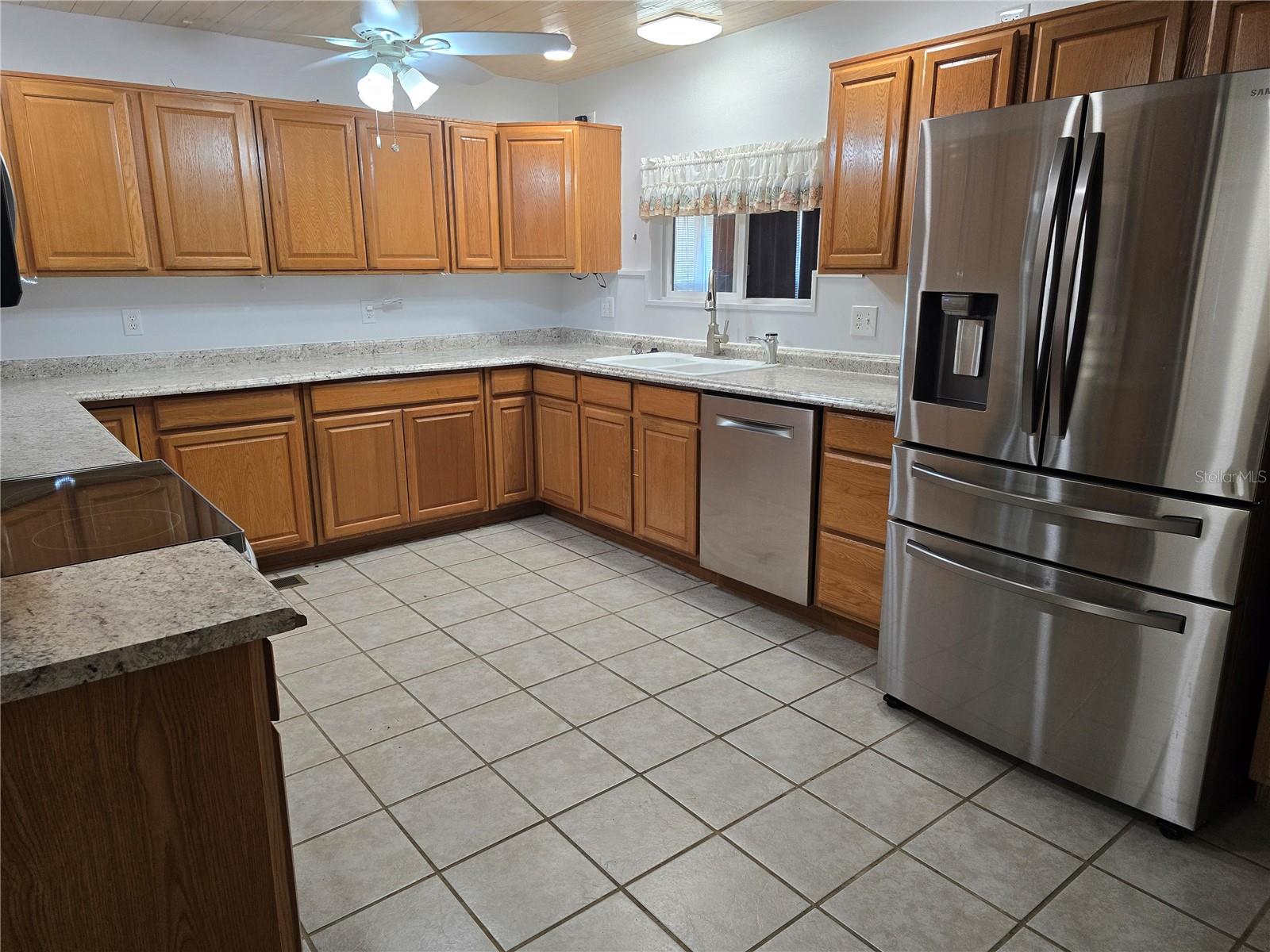 LARGE KITCHEN WITH WOOD CABINETS