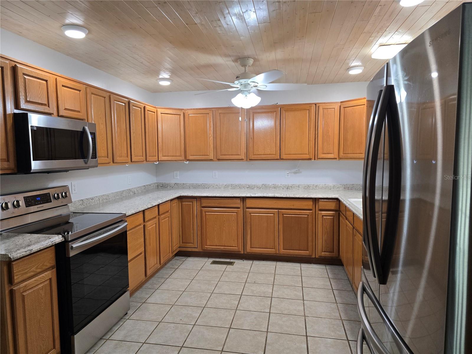 LARGE KITCHEN WITH WOOD CABINETS