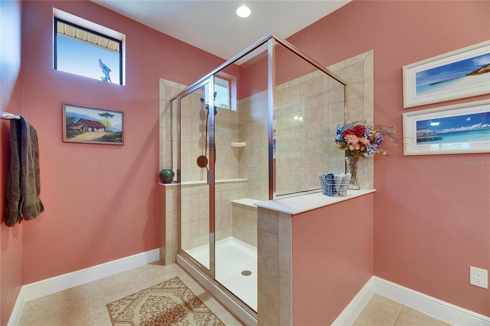 Owner's shower with built-in seat.