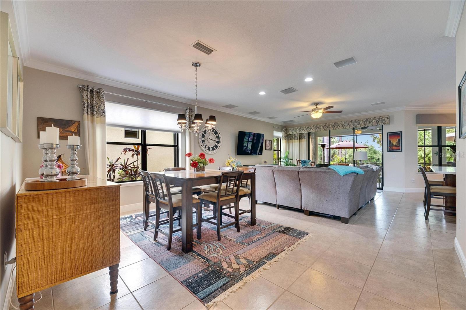 Dining room and living room with breakfast bar on the right.