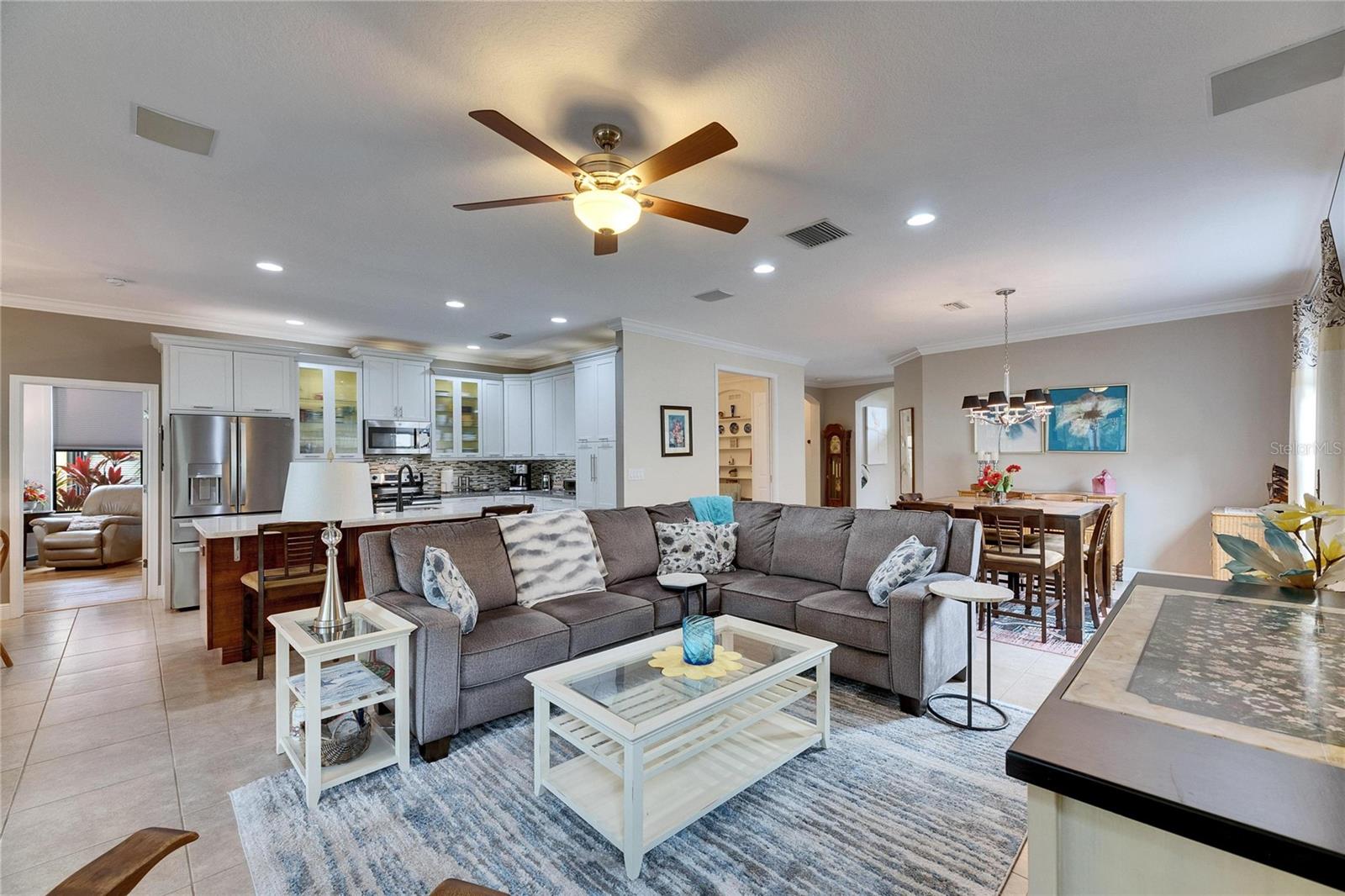 Living room with updated kitchen in the back.