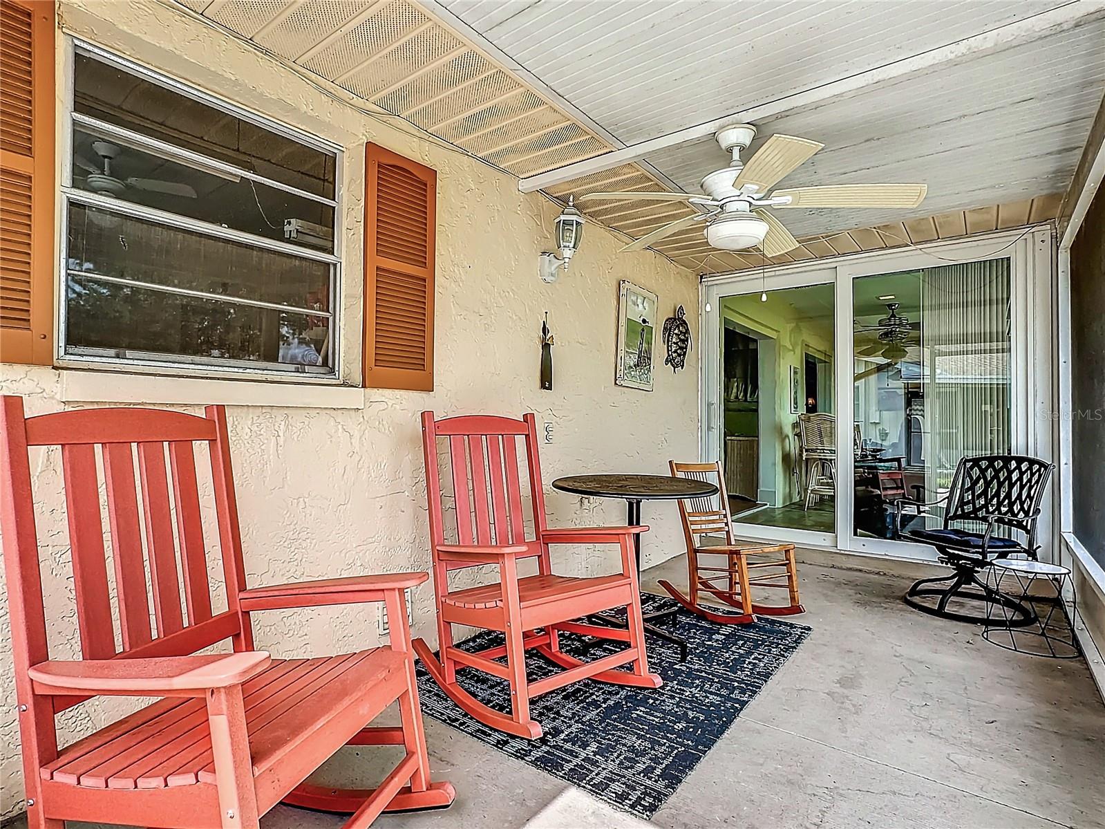 Screened porch with serene pond view