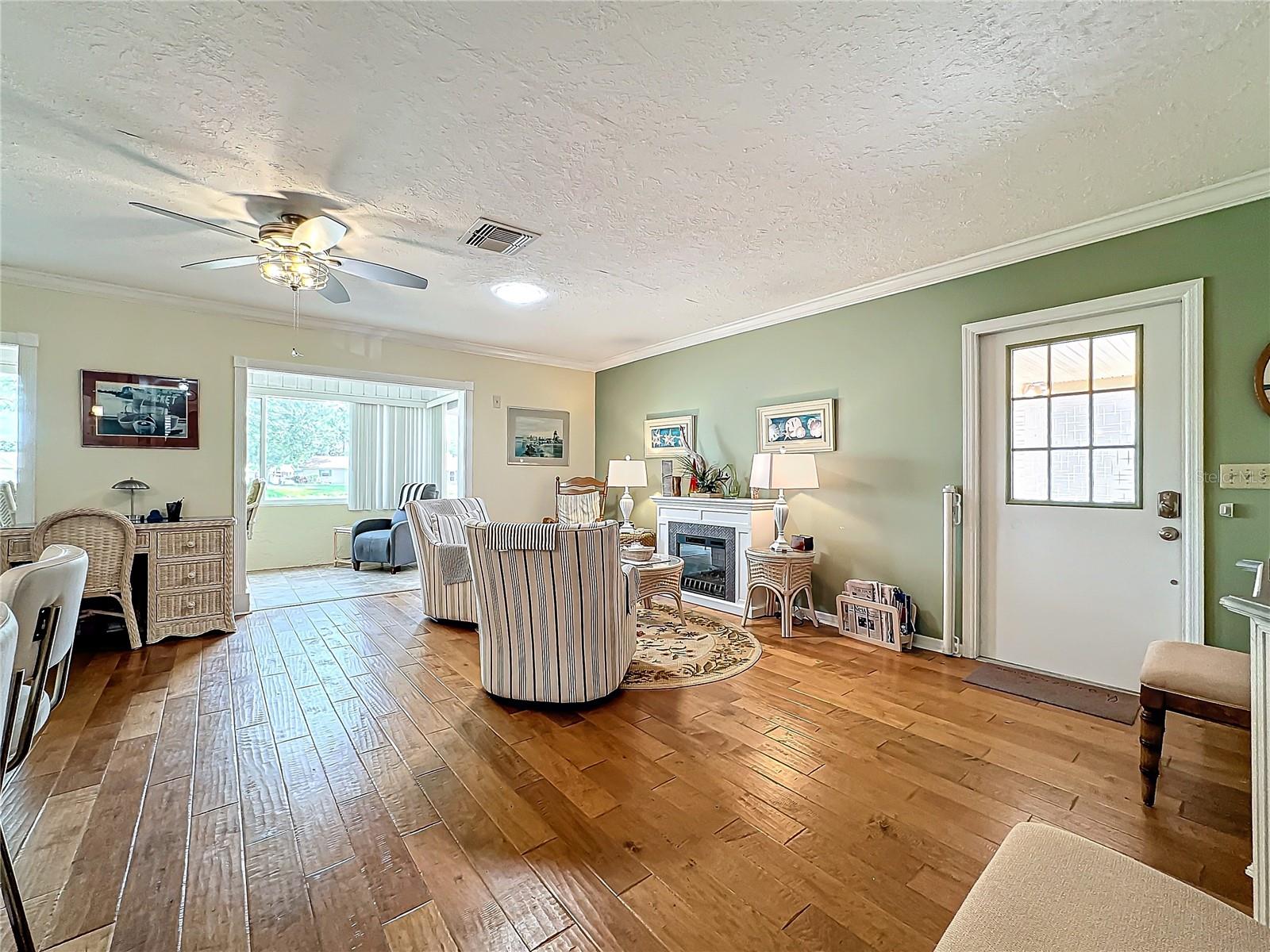 Living Room with Crown Molding and Sola Tube