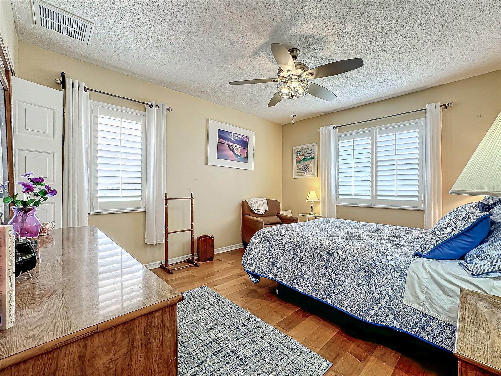 PRIMARY BEDROOM, Maple floors, Plantation shutters