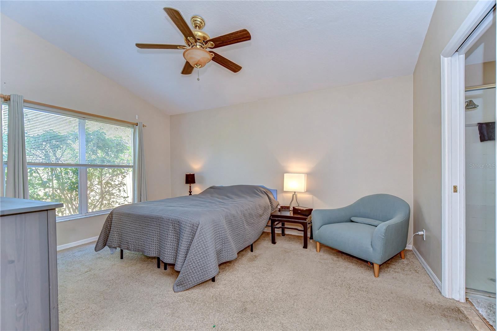 Step into your serene primary bedroom oasis, bathed in natural light .