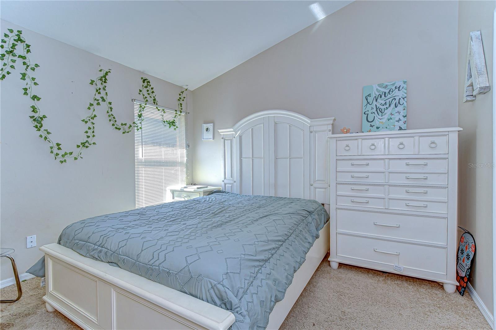 Step into serenity with this bright and airy bedroom, featuring soothing natural light and an elegant design.