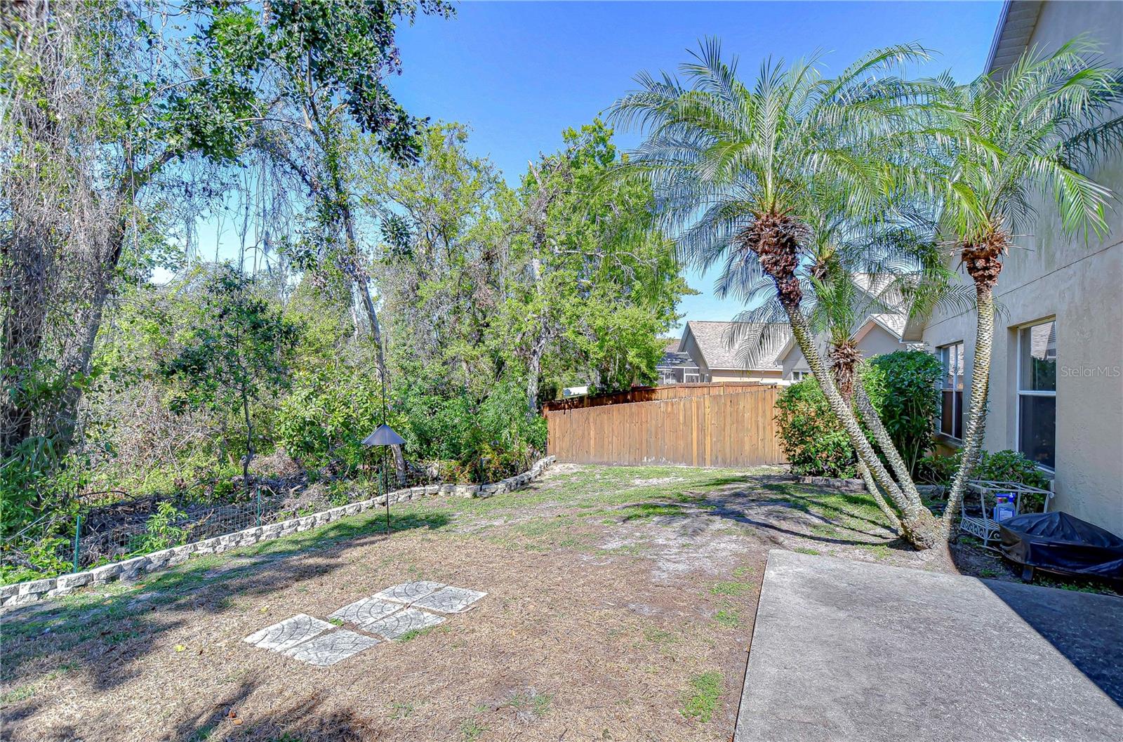 Perfect for garden enthusiasts or anyone craving a quiet retreat, this outdoor space provides a lush backdrop for relaxation or entertaining.