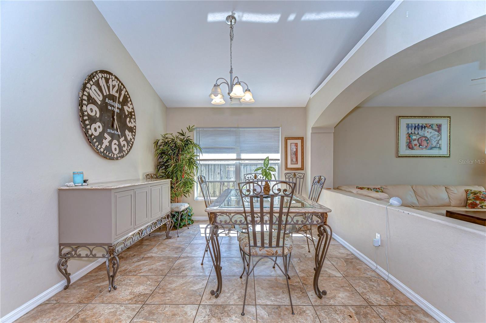 Step into this inviting dining space with elegant tile flooring and an abundance of natural light