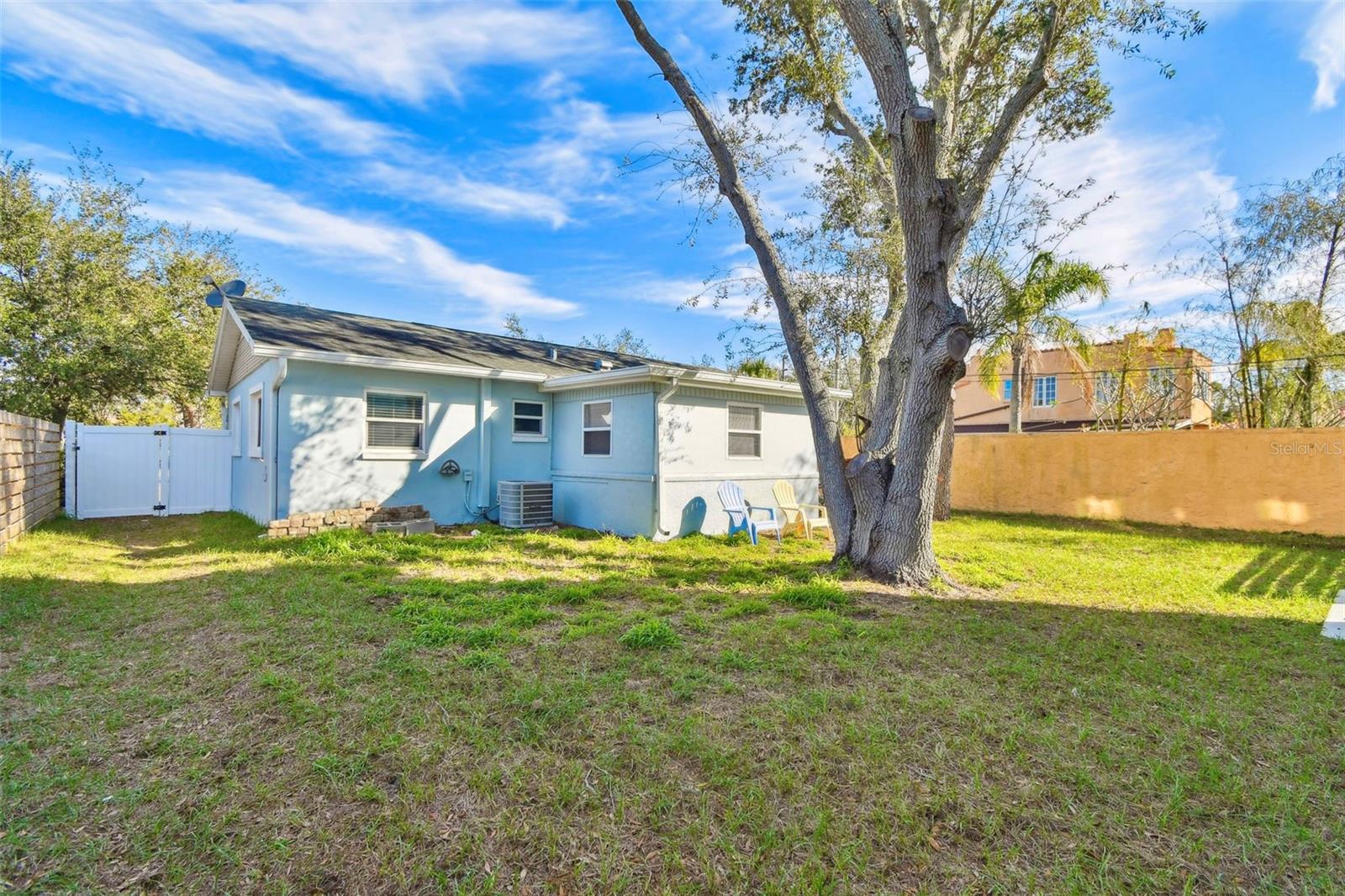 Rear image of single family home on front of property.