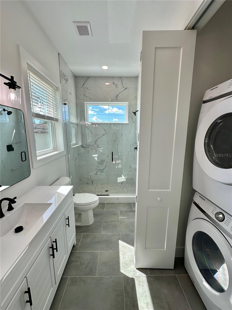 Laundry closet with full-size stacked washer and dryer (ADU)