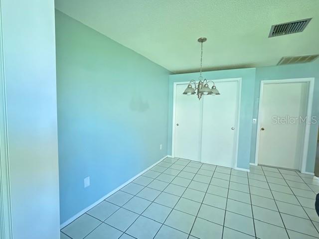 Dinette off kitchen with large pantry closet.