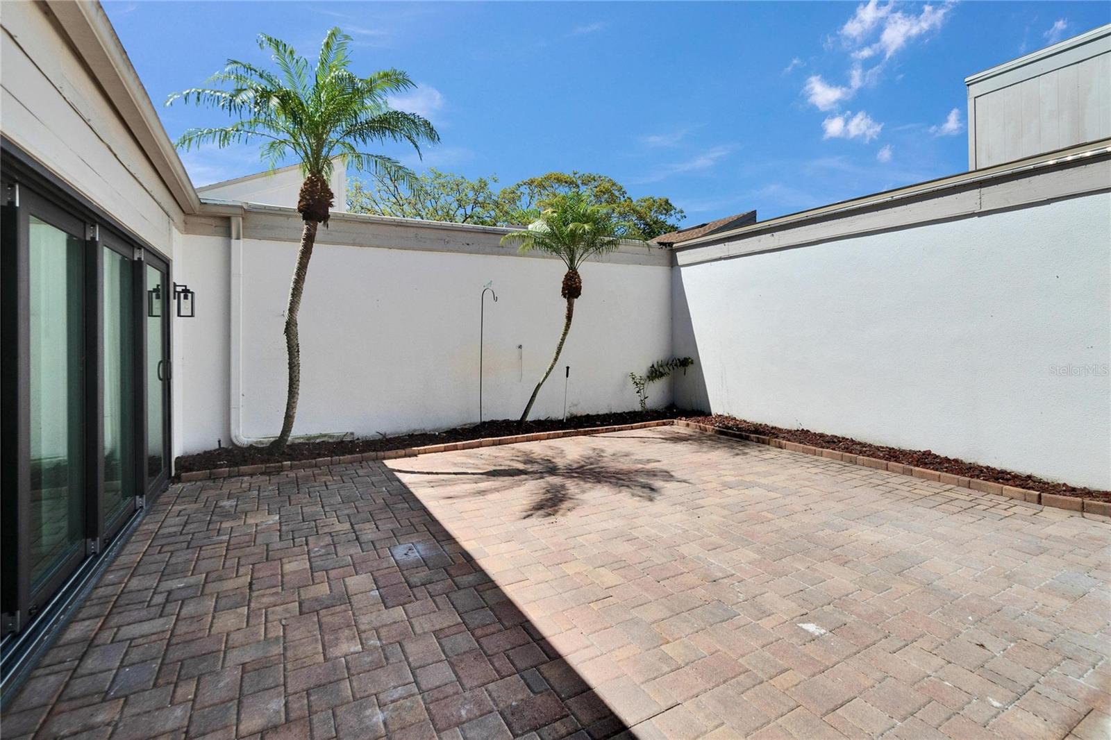 Outdoor Patio w/Brick pavers & Privacy wall