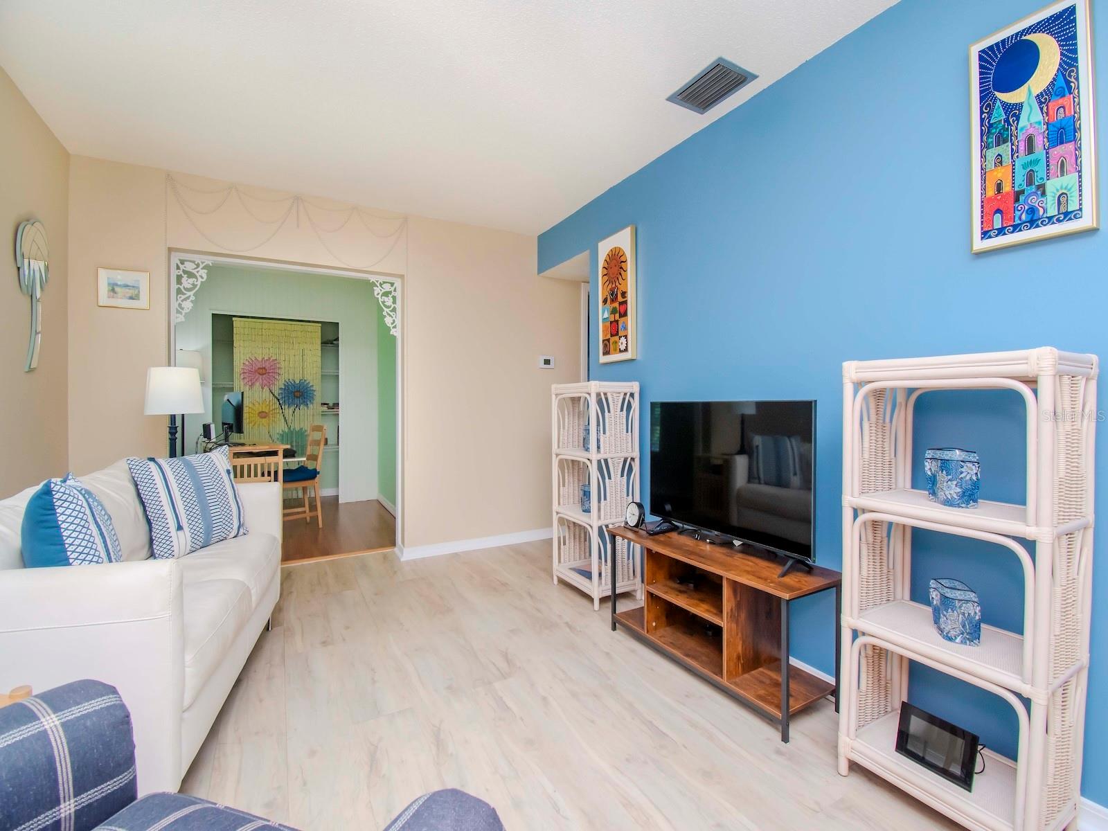 Living room with views into Bonus room